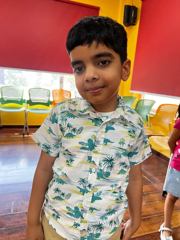 A camper smiling at the summer camp dance class