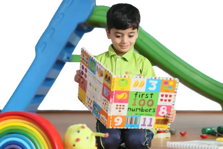 A Skill-ed child happily reading a picture book about numbers