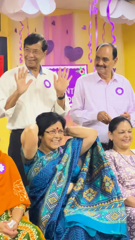 Grandparents laughing and waving from their seats