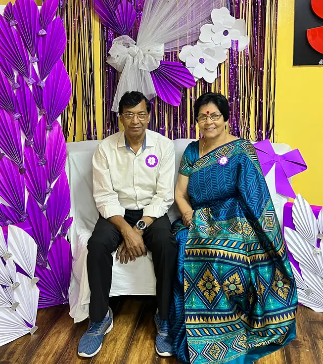 Grandparents at the purple flower booth on Grandparents Day