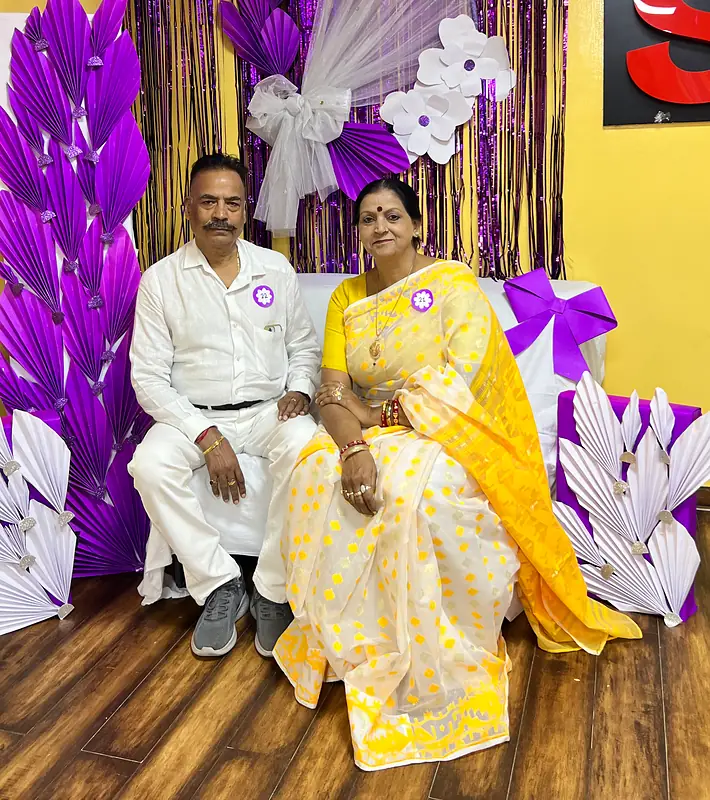 Grandparents at the purple flower booth on Grandparents Day