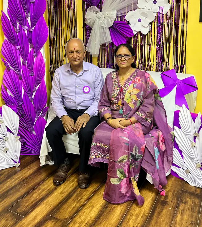 Grandparents at the purple flower booth on Grandparents Day