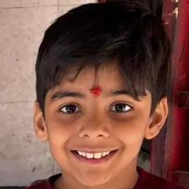 A smiling Skill-ed alumnus